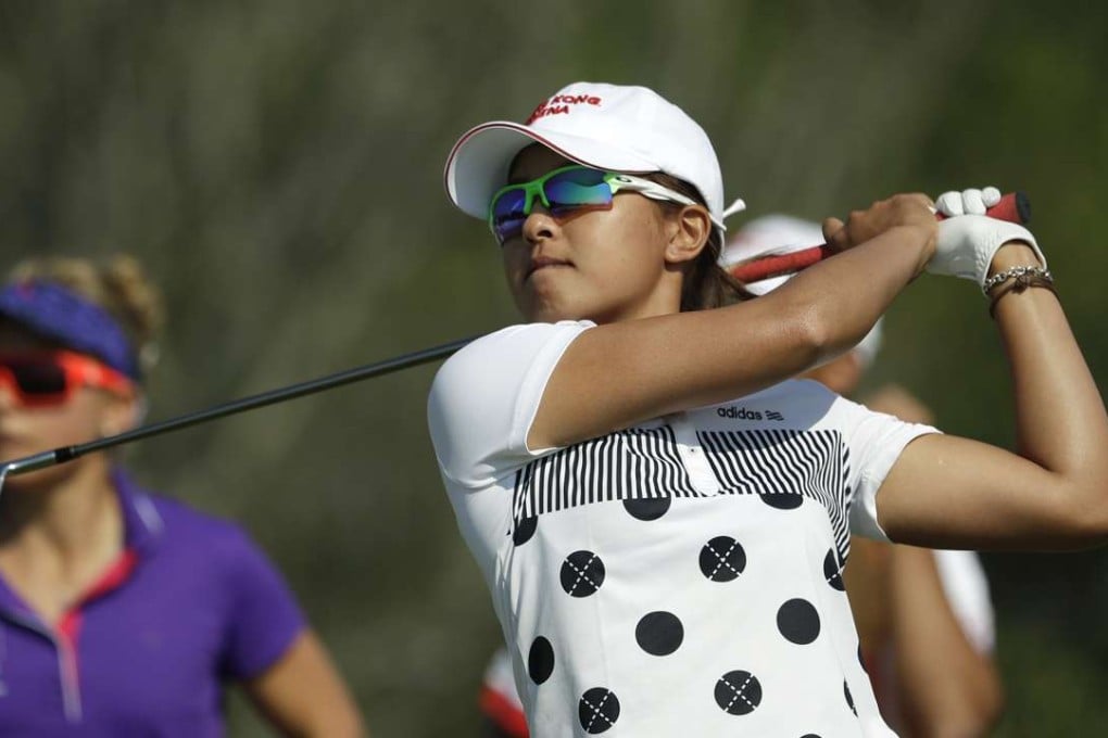 Tiffany Chan Tsz-ching of Hong Kong, watches her tee shot on the 4th hole during the first round of the women's golf event at the 2016 Summer Olympics in Rio de Janeiro, Brazil, Wednesday, Aug. 17, 2016. (AP Photo/Alastair Grant)