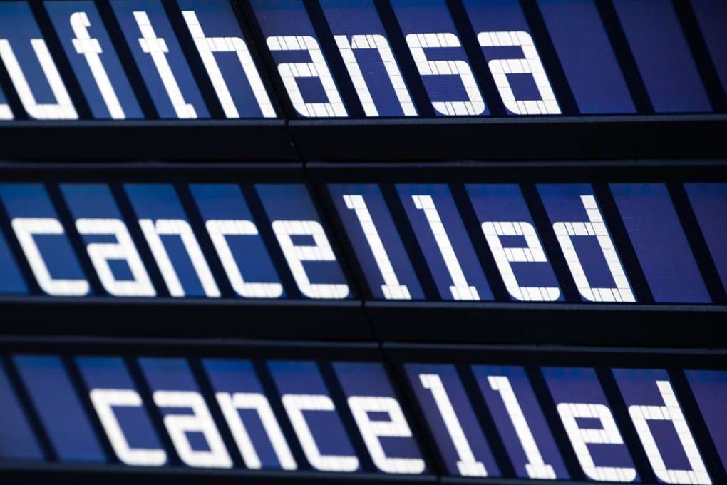 The words 'Lufthansa' and 'cancelled' on the display board at the airport in Munich, Germany. Photo: EPA