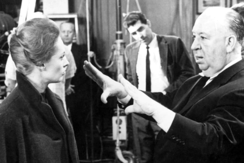 Alfred Hitchcock with actress Tippi Hedren on the set of Marnie (1964).