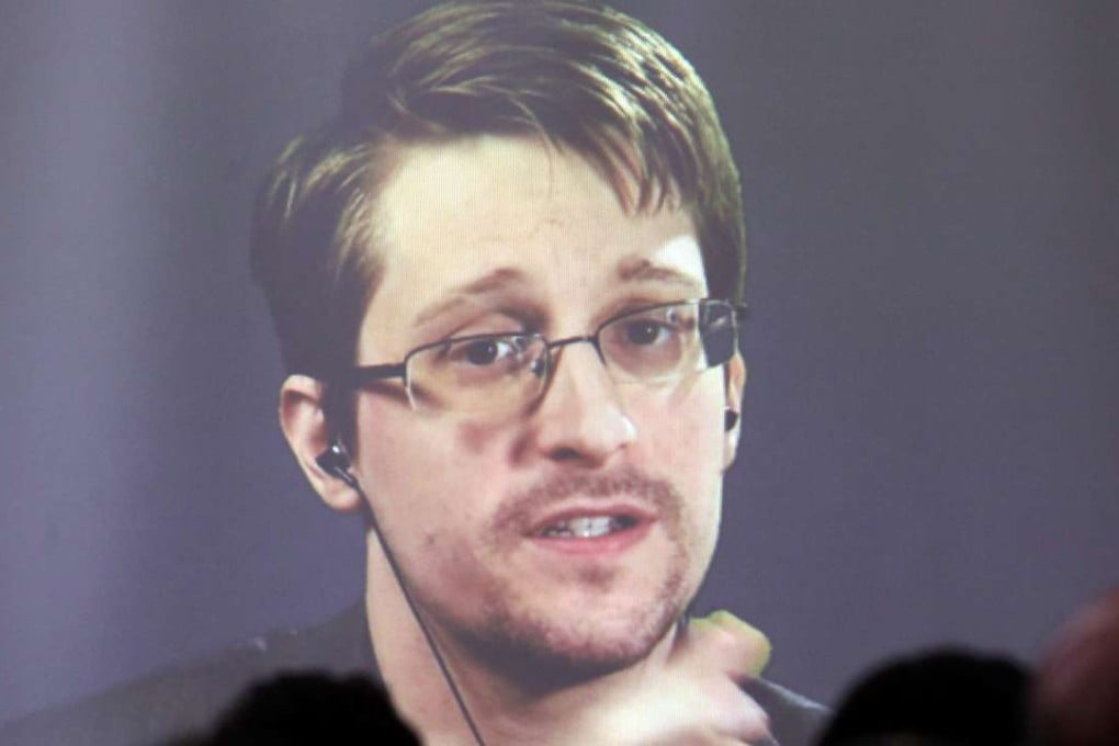 Edward Snowden speaks via video link during a conference. Photo: Reuters