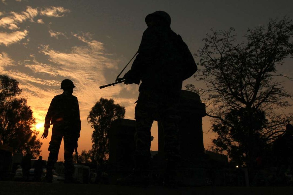Indian army soldiers patrol on the Jammu-Srinigar National Highway during a combing operation. Photo: AFP