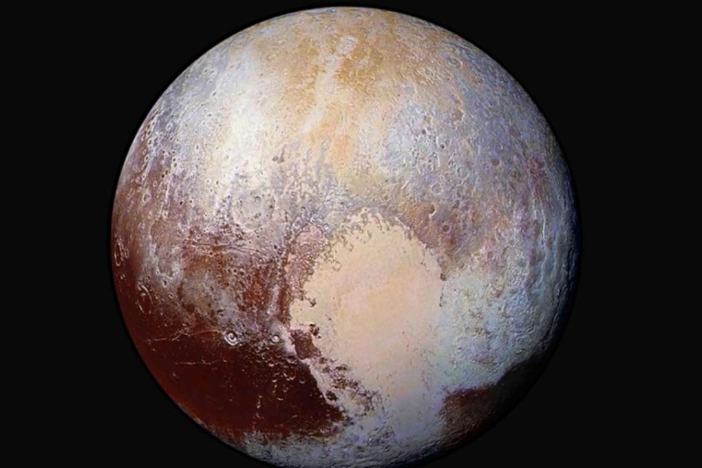 An enhanced image of Pluto shows the accumulation of ice in the planet’s coldest region. Photo: Nasa