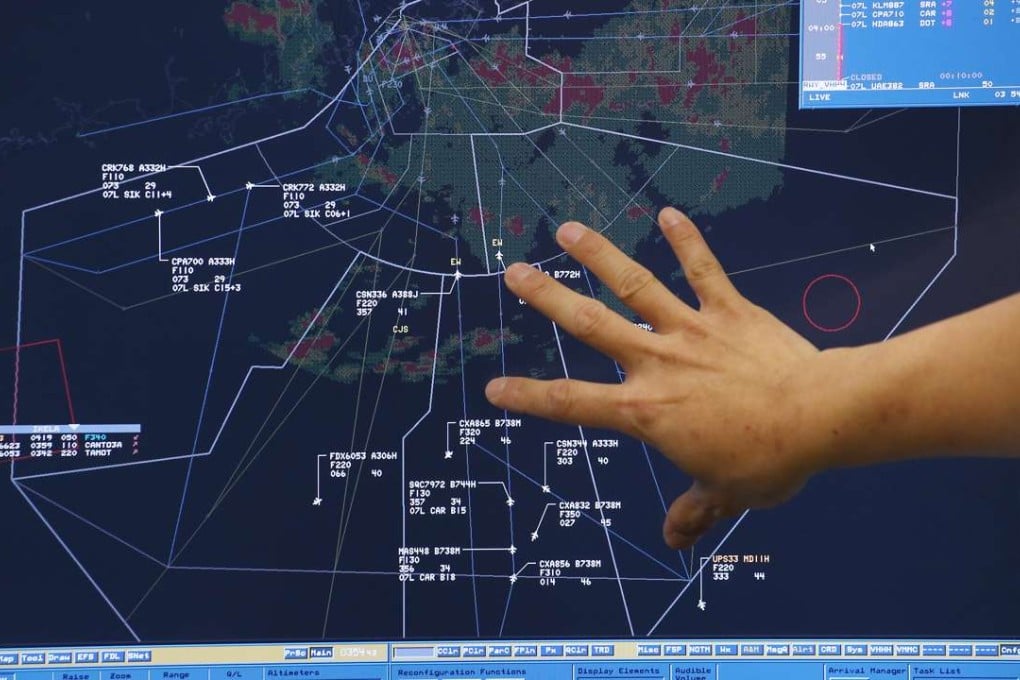 Air traffic controllers getting to grips with the new system, more than a week after it was fully commissioned. Photo: Dickson Lee