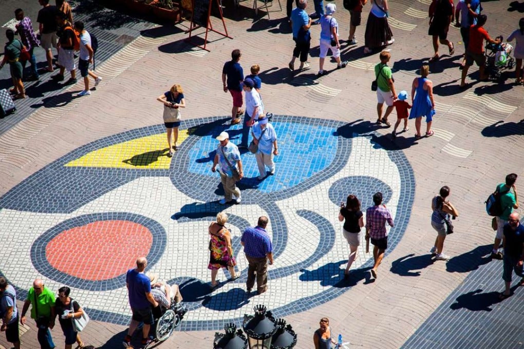 A mosaic on Las Ramblas, the pedestrianised boulevard that serves as ground zero for tourists. Picture: Alamy