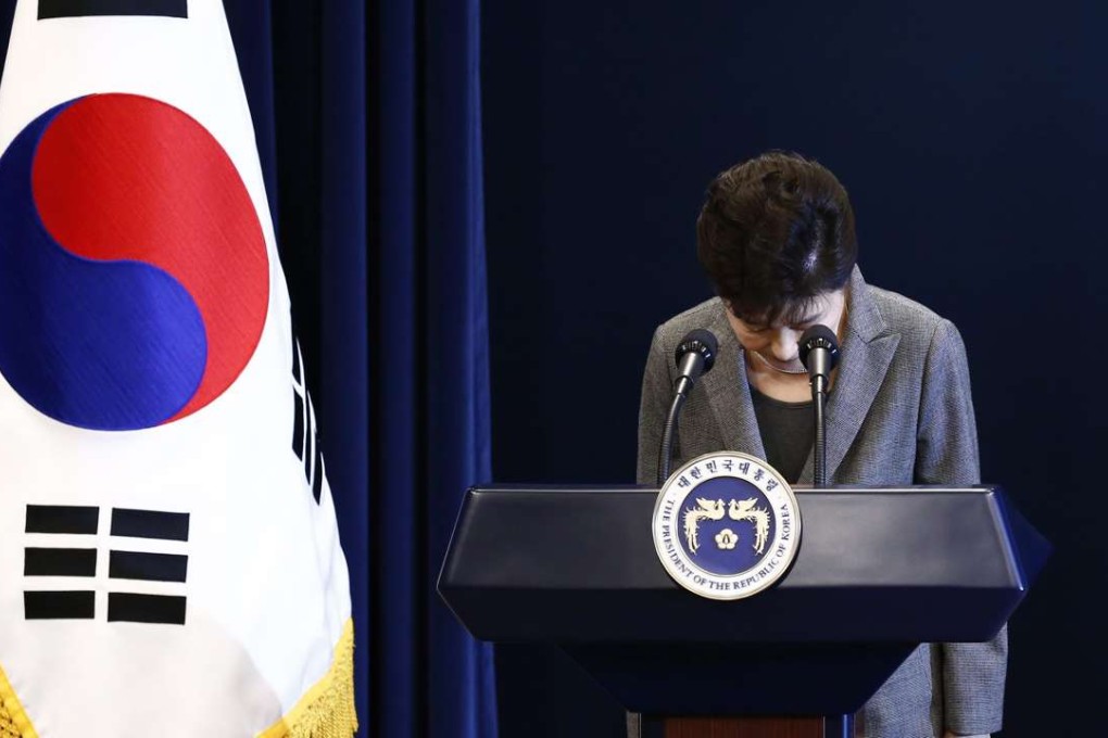 South Korean President Park Geun-Hye bows during an address to the nation after Park Geun-hye announced she was willing to stand down early. Photo: EPA