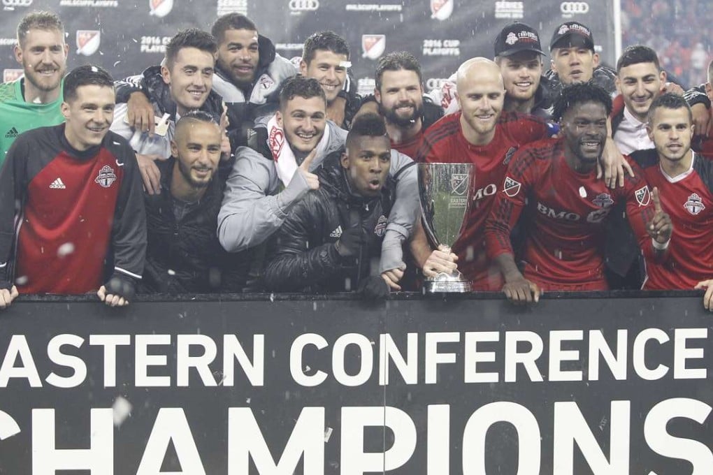 Toronto FC pose with the Eastern Conference trophy after defeating the Montreal Impact in the second leg of the MLS Eastern Conference Championship at BMO Field. Photo: USA Today