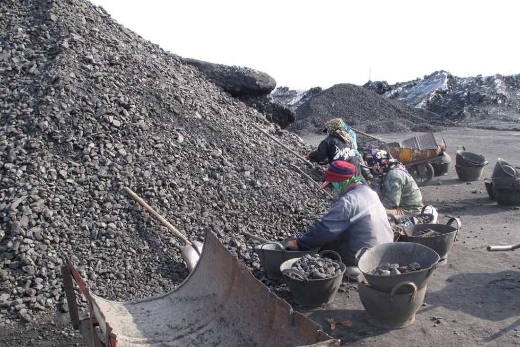 A file picture of workers sorting coal at a pit in Heilongjiang province. Coal is one the main industries the government is targeting in its campaign to reduce overcapacity. Photo: Reuters