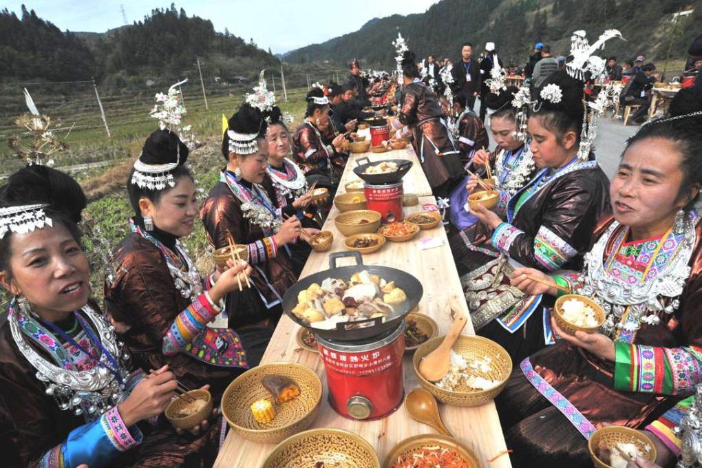 Dong women in Liping county enjoying their new year feast. Photo: Xinhua