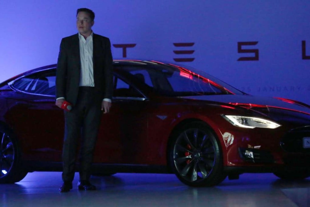 Tesla CEO Elon Musk next to a Model S which, along with the Model X, will receive incremental updates to their autopilot features. Photo: Nora Tam