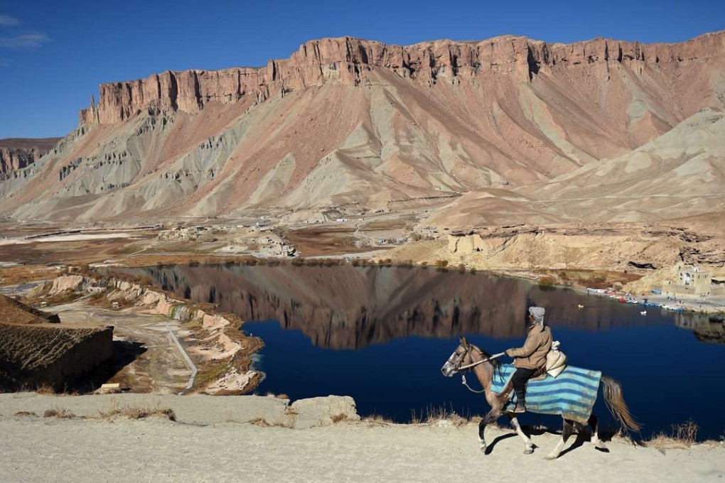 An Afghan man rides a horse past Band-e-Amir lake, in the Bamiyan valley, a key node in the Silk Road that once linked China with Central Asia and beyond. China’s belt and road can take its inspiration from not only the old Silk Road, but also a successor closer to our time. Photo: AFP