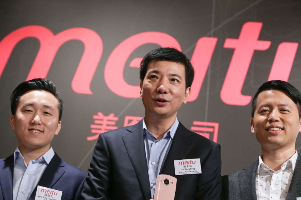 (L-R) Gary Ngan King-leung, chief financial officer, Cai Wensheng, founder, executive director and chairman, and Wu Xinhong, founder, executive director and chief executive officer of Meitu, announce their IPO plans in Hong Kong on Friday. Photo: Dickson Lee