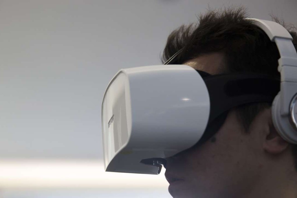 A user tests the Fove 0, a virtual reality headset with eye-tracking capabilities. Photo: Bloomberg