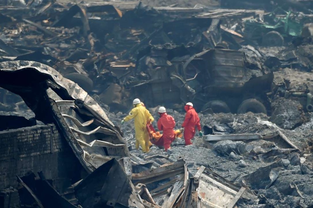 Rescuers retrieve a body from the core blast site at industrial chemical storage complex in Tianjin in August, 2015. The blast killed more than 170 people, including scores of police and firefighters. Xinhua