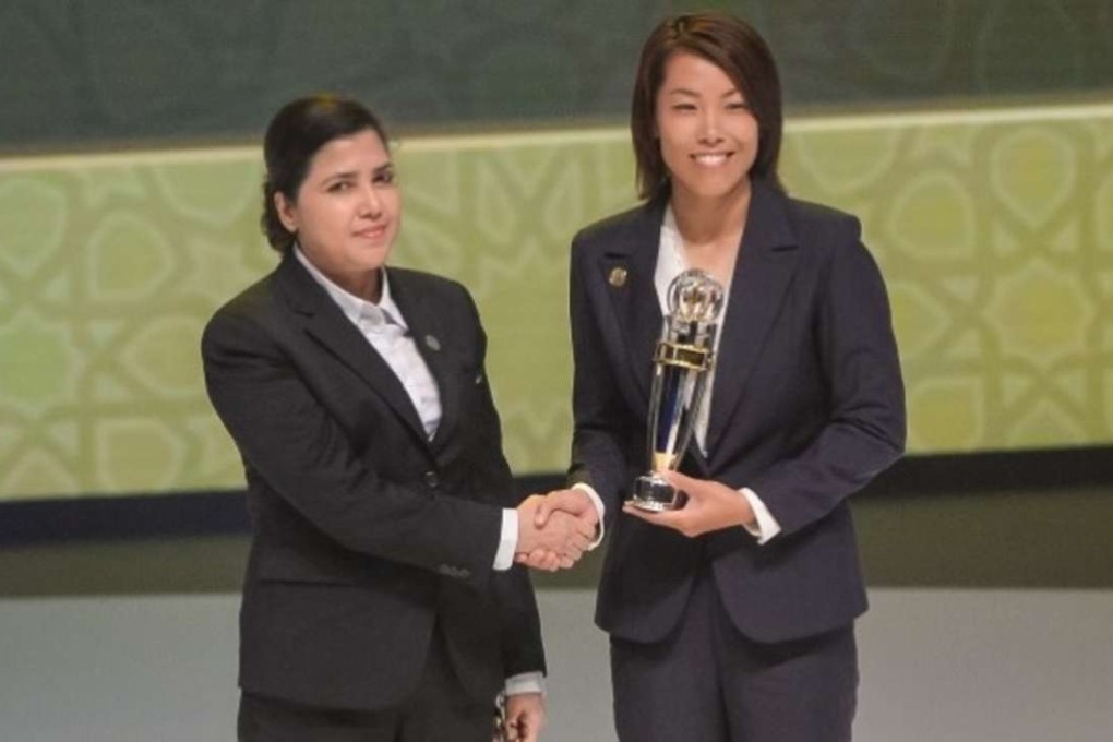 Eastern coach Chan Yuen-ting receives her award at a glitzy ceremony held in Abu Dhabi on Thursday night.