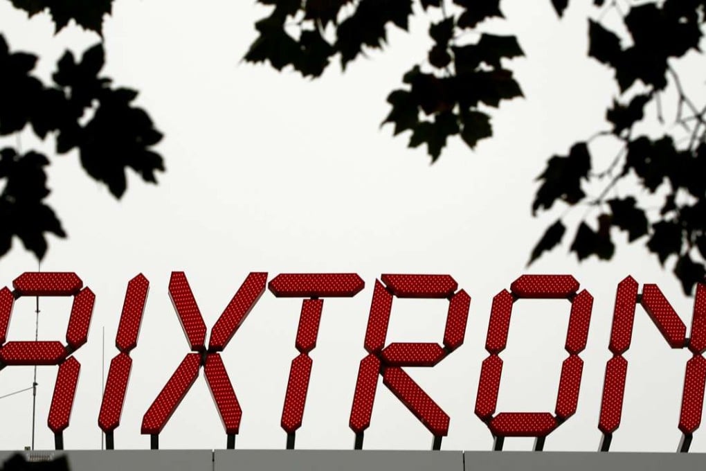 The logo of Aixtron SE is pictured on the roof of the German chip equipment maker's headquarters in Herzogenrath near the western German city of Aachen. Photo: Reuters