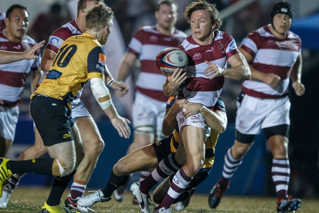Kowloon fly half Jack Neville looks for an option against Tigers. Photo: SCMP Pictures