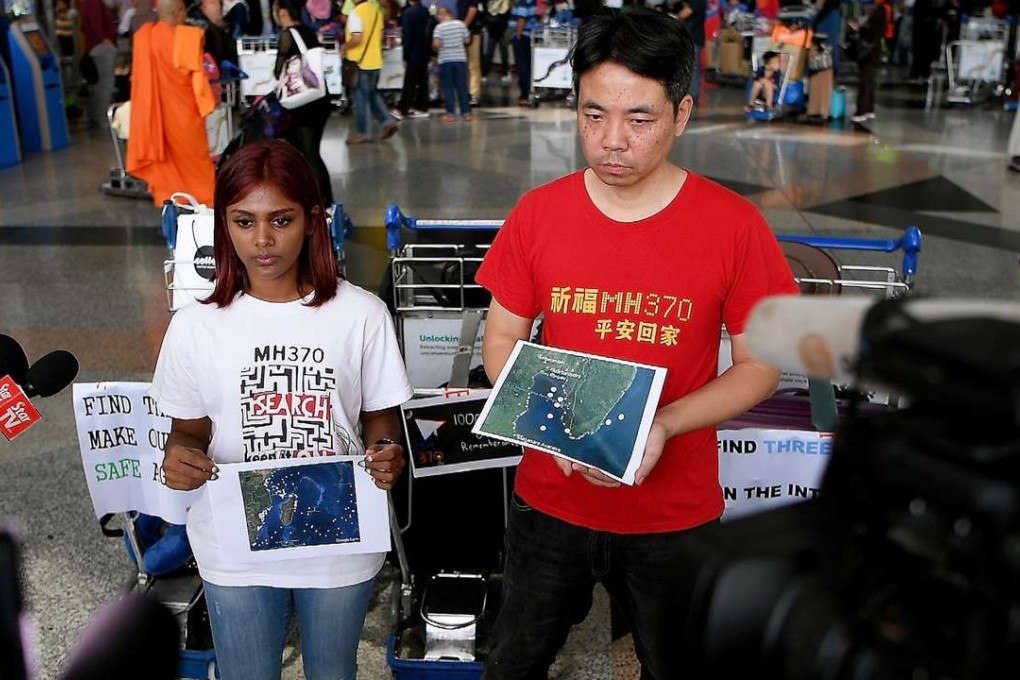Grace Nathan (left), whose mother Anne Daisy was on board the missing Malaysia Airlines flight MH370, and Chinese national Jiang Hui, who also had a relative onboard the flight, address the media prior to departing for Madagascar. Photo: AFP