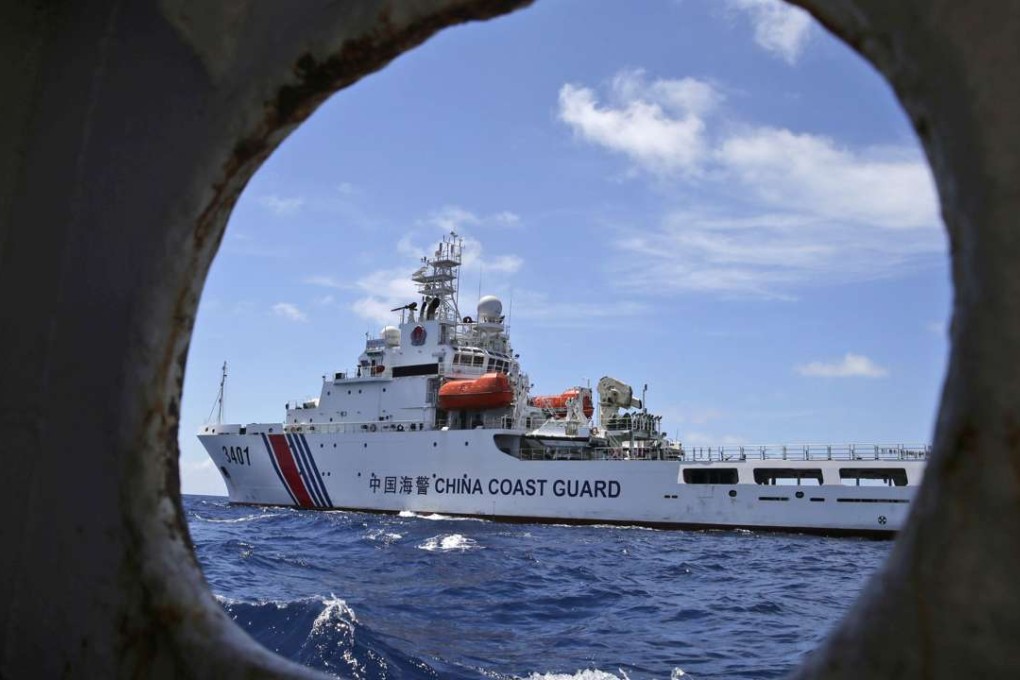 A Chinese coastguard ship is seen from a Philippine government vessel in the South China Sea in March 2014. Photo: AP