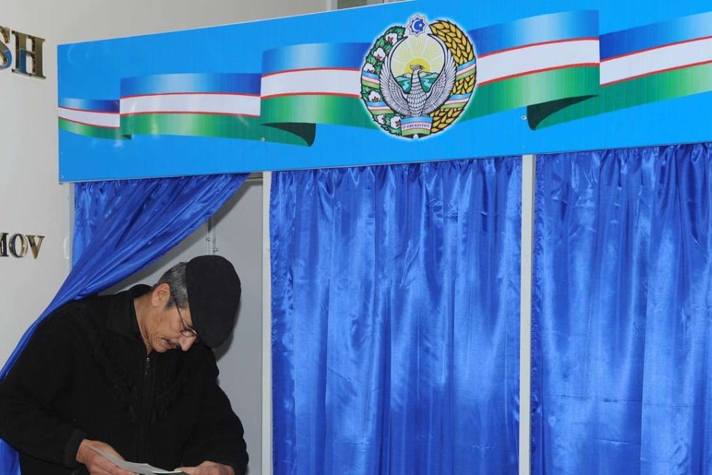 A man votes at a polling station in Tashkent, Uzbekistan. Photo: Xinhua