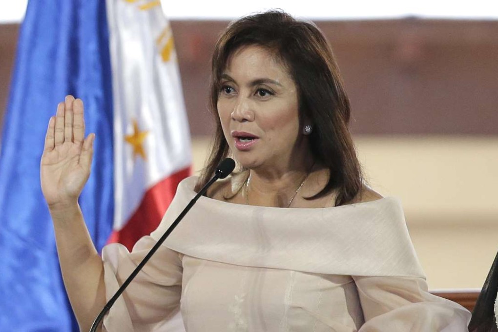 FILE- In this June 30, 2016 file photo, Philippine Vice President Leni Robredo is sworn in during inauguration ceremonies in suburban Quezon city, north of Manila, Philippines. The Philippine vice president says she will resign her Cabinet post, citing "major differences in principles and values" with President Rodrigo Duterte and an unspecified plot to remove her from the vice presidency. Leni Robredo said Sunday, Dec. 4, 2016 that she will resign Monday as housing secretary, an appointment made by Duterte, but will stay on in her elected post as vice president. (AP Photo/Aaron Favila, File)