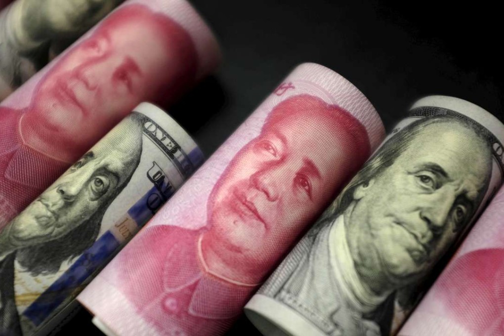 The PBOC will likely confront further downside pressure on the yuan when the US$50,000 annual quota on yuan conversion refreshes in January. Photo: Reuters