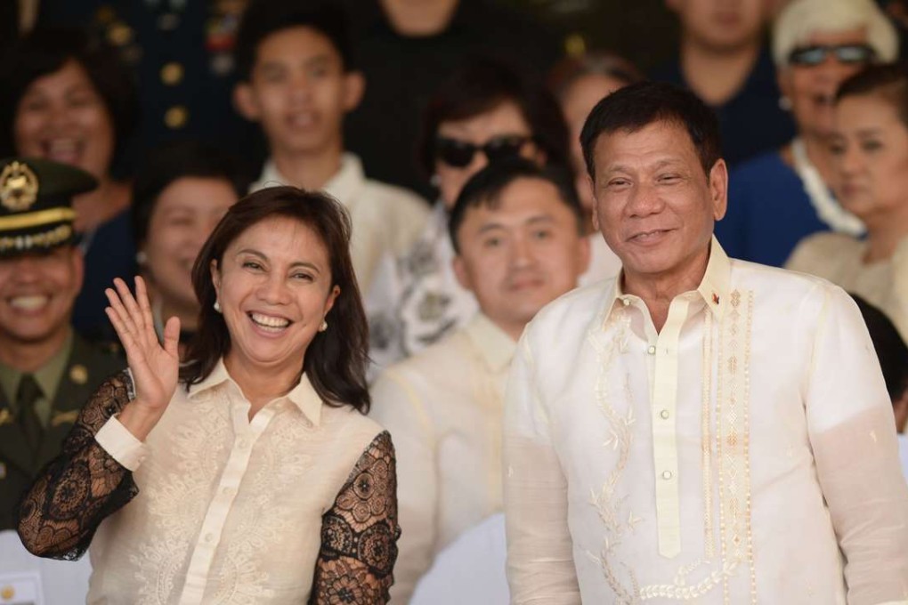 Philippines' President Rodrigo Duterte posing for photographs with Vice-President Leni Robredo during happier times. Photo: AFP