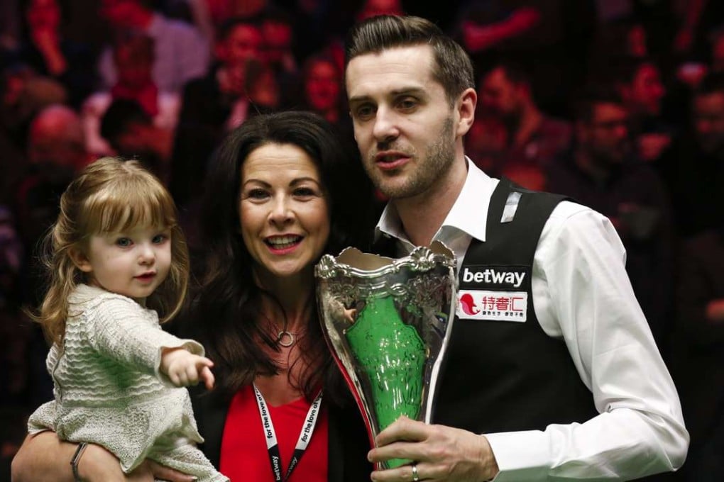 England’s Mark Selby celebrates with his family after winning the final of the UK Championship against Ronnie O’Sullivan in York. Photo: Xinhua