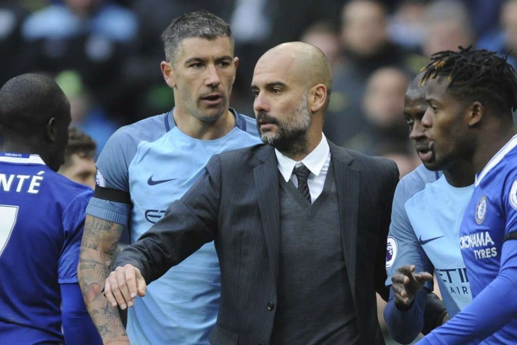 Manchester City manager Pep Guardiola tries to cool things down during Saturday’s clash. Photo: AP