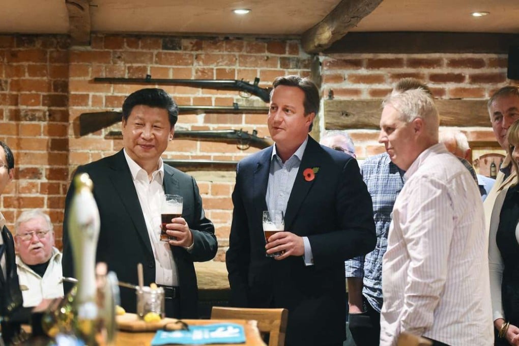 British Prime Minister David Cameron (centre) and President Xi Jinping (third left) pictured at the pub in Buckinghamshire in October last year. Photo: AFP