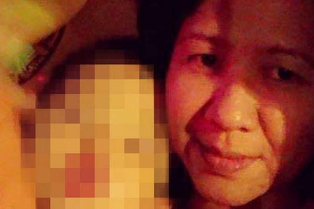 The deceased on Thanksgiving day holding a boy. Photo: SCMP Pictures