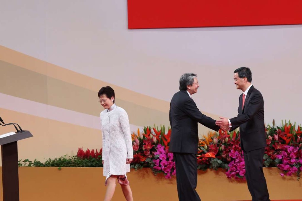 Carrie Lam exits as John Tsang (left) is greeted by Leung Chun-ying before the storm over questions broke. Photo: Sam Tsang