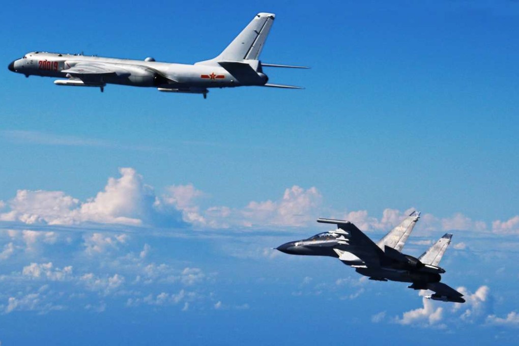 A file picture of a PLA Su-30 fighter and an H-6K bomber taking part in a drill in the Western Pacific in September. Photo: Xinhua