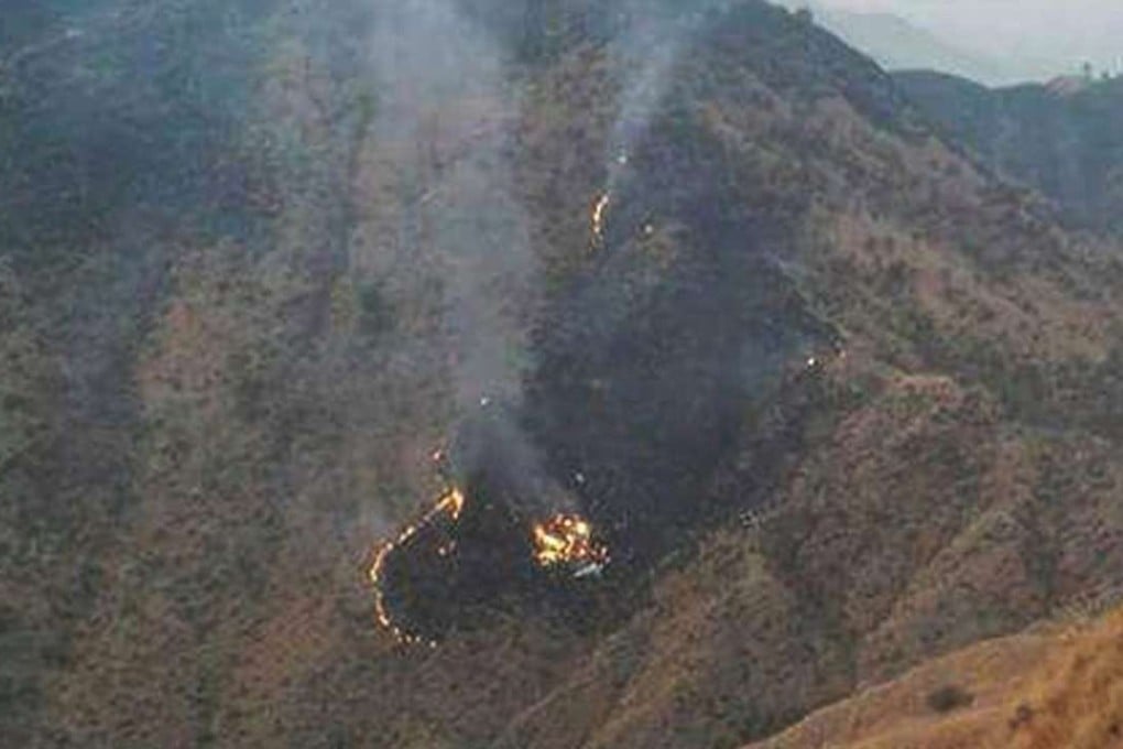 Flames rise from the wreckage of a Pakistan International Airlines (PIA) ATR 42 turboprop passenger plane. Photo: EPA