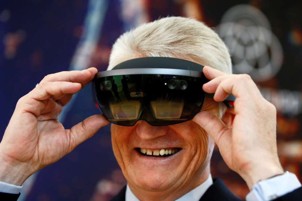 Heinrich Hiesinger, chief executive of Germany’s ThyssenKrupp, tries out a HoloLens. Photo: Reuters
