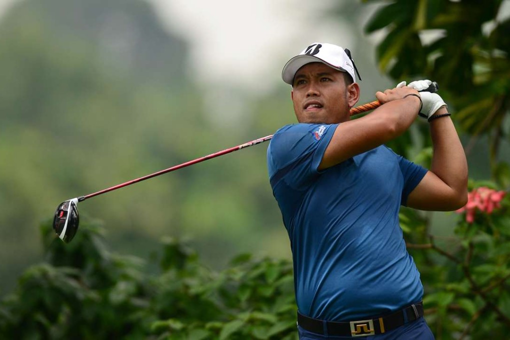 Chinnarat Phadungsil of Thailand hits a shot during round one of the Bank BRI JCB Indonesia Open 2016 at Pondok Indah Golf Course in Jakarta on November 17, 2016. / AFP PHOTO /