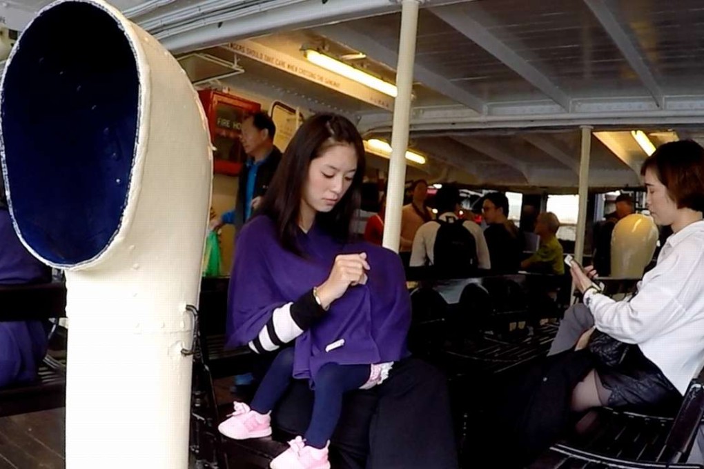 Season Choi, who says she faces discrimination when feeding her 15 month old baby in public, on the Star Ferry. Photo: SCMP Pictures