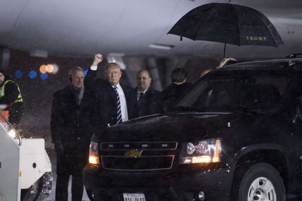 US president-elect Donald Trump waves before boarding his plane in Grand Rapids, Michigan. Photo: AFP