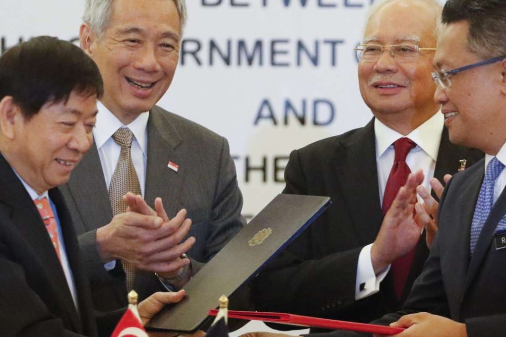 Representatives including Singapore Prime Minister Lee Hsien Loong (second left) and Malaysian Prime Minister Najib Razak (second right) at the signing of the memorandum of understanding over the link in July. Photo: EPA