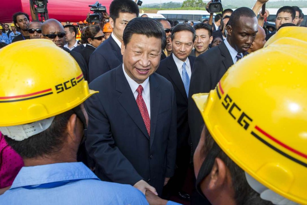 China’s President Xi Jinping shake hands with Chinese construction workers in Port-of-Spain, Trinidad and Tobago. His latest trip to the region is his third since taking office in early 2013, when this photo was taken. Photo: AFP
