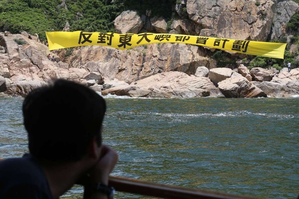 Members of the Save Lantau Alliance hang a banner on Kau Yi Chau against the reclamation plan. Photo: K. Y. Cheng