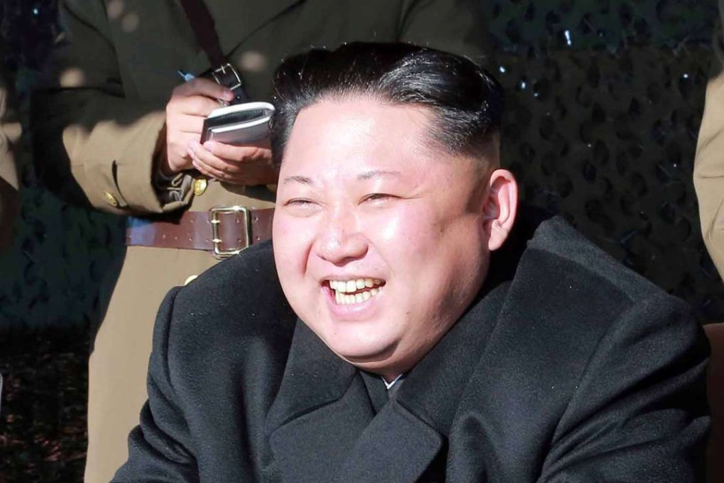 Rodong Sinmun carried a two-page report of the drill, showing several pictures of a building resembling the Blue House being invaded by the North’s troops and destroyed, as well as one of Kim roaring with laughter as he watched the simulated attack. Photo: Reuters