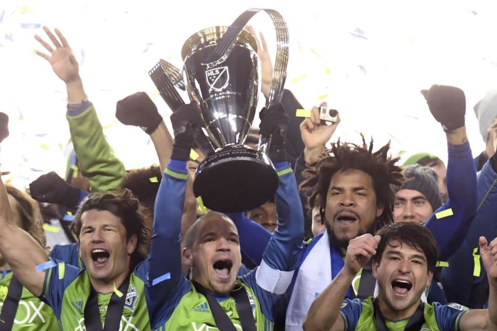 Seattle Sounders players celebrate after winning the MLS Cup final against Toronto FC in Toronto. Photo: AP