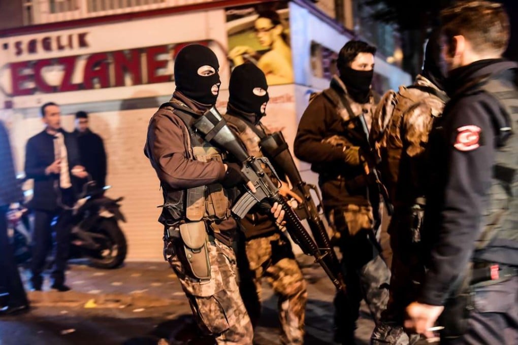 Turkish special force police officers patrol streets after a car bomb exploded near the stadium of football club Besiktas in Istanbul. Photo: AFP