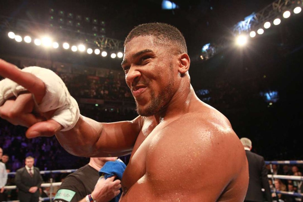 Anthony Joshua celebrates after knocking out Erik Molina in the third round during his IBF world heavyweight defence against Eric Molina at the Manchester Arena. Photo: EPA