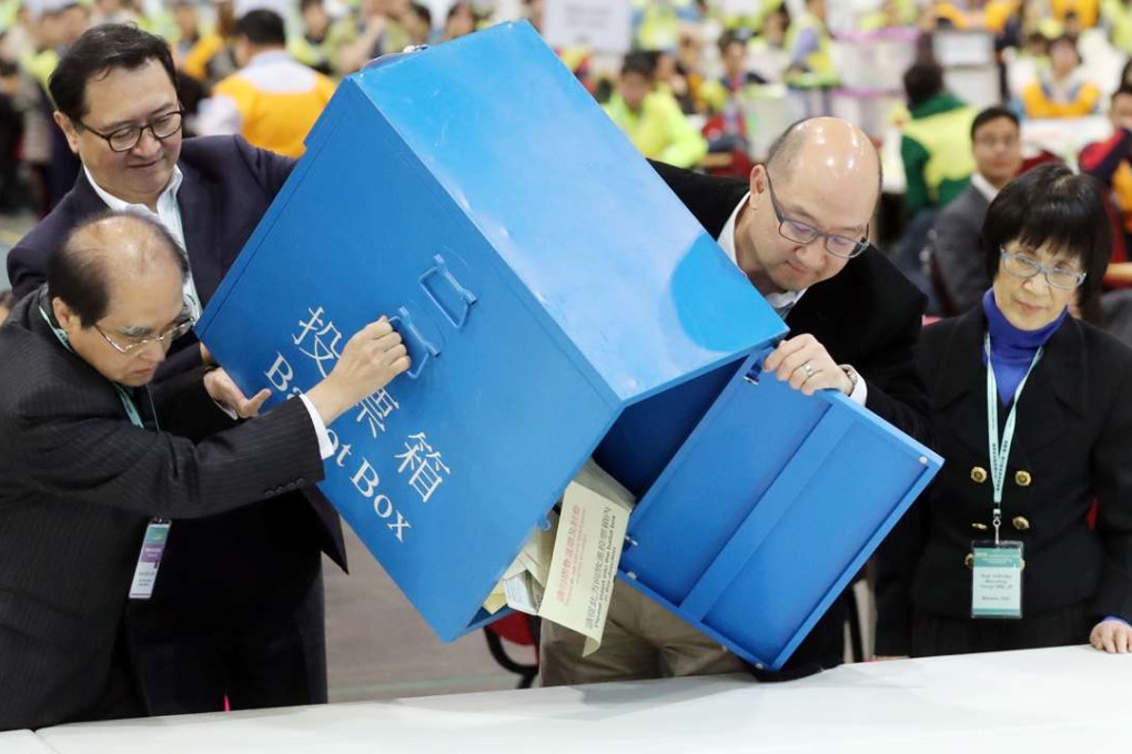 Justice Barnabas Fung Wah(top left) Secretary for Constitutional and Mainland Affairs Raymond Tam Chi-yuen(R2) attend the central counting of Election Committee subsector ordinary elections at Airport Expo. Photo: Edward Wong