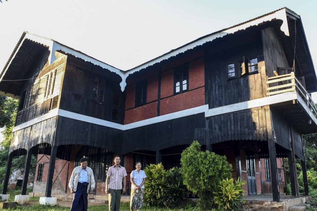 Amateur George Orwell scholar Nyo Ko Naing, centre, leaves the house of the former British commissioner in Katha with the caretaker, right, and Kyal Ni, member of the local office of the National League for Democracy, in Katha, Myanmar. Many of the places depicted in George Orwell's novel Burmese Days remain standing in a sleepy Myanmar town, nearly 90 years after he left it. Now residents of Katha are working to make the most of that heritage, including by renovating a historic house to be a museum. Photo: AP