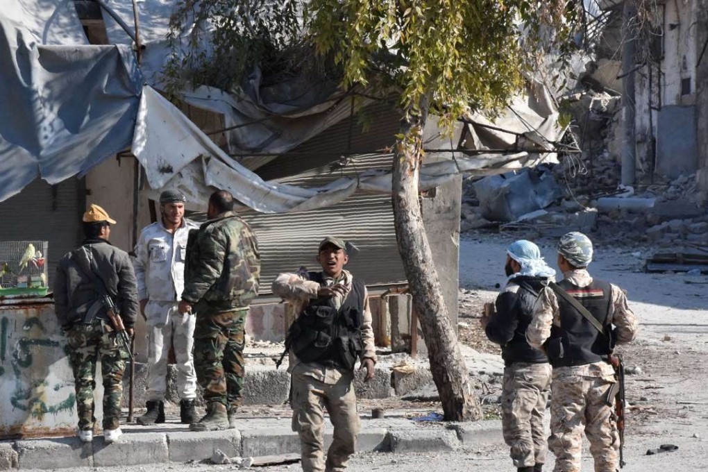 Syrian government forces patrol the area of Marja Square and the surrounding neighbourhoods in Aleppo. Photo: AFP