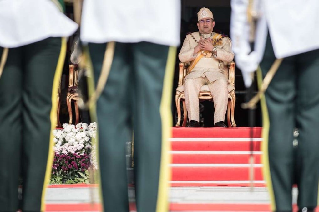 Sultan Muhammad V, the incoming 15th king of Malaysia, offers prayers during the king's welcoming ceremony at Parliament House in Kuala Lumpur. Photo: AFP
