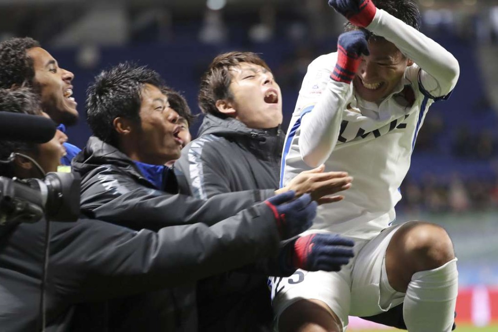 Kashima Antlers' Yasushi Endo celebrates with teammates after scoring against Atletico Nacional in their Club World Cup semi-final. Kashima won 3-0. Photo: AP
