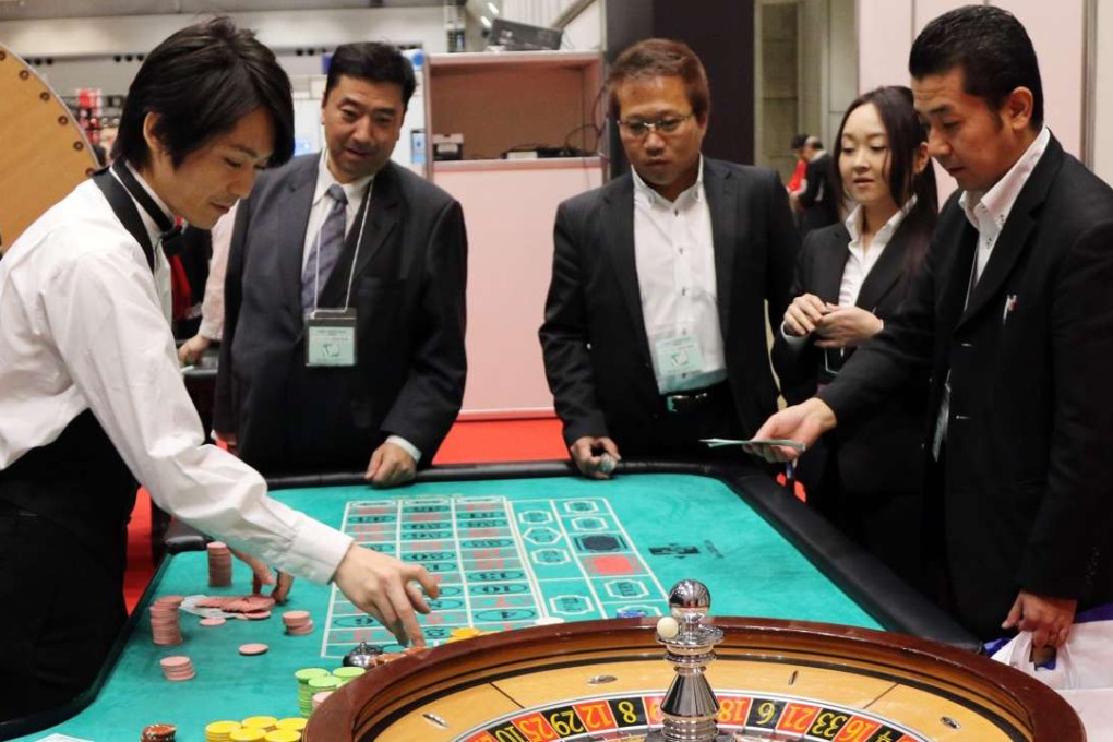 A dealer demonstrating how to play roulette at a leisure exhibition in Tokyo. Photo: AFP